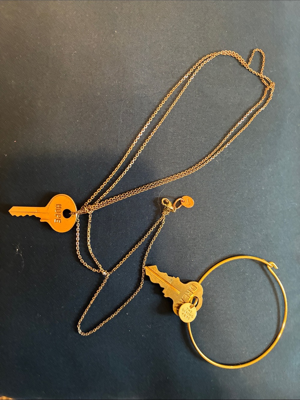 Gold Tone Bangle Bracelet by the “Giving Keys”